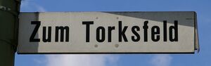 Straßenschild Zum Torksfeld